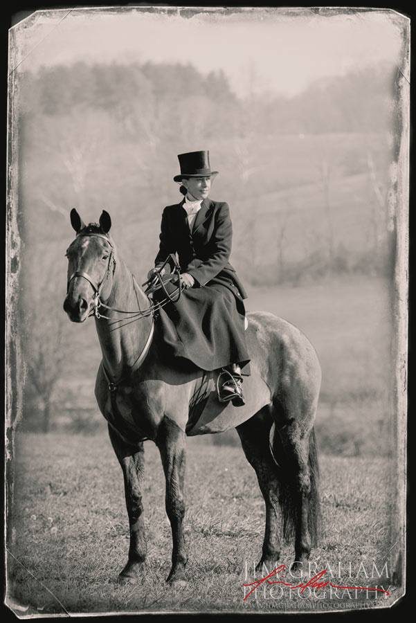 A woman in a top hat riding a horse.