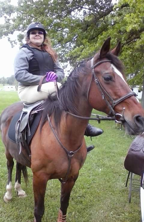 Person, riding on a horse and outdoor may contain person, riding on a horse and outdoor.