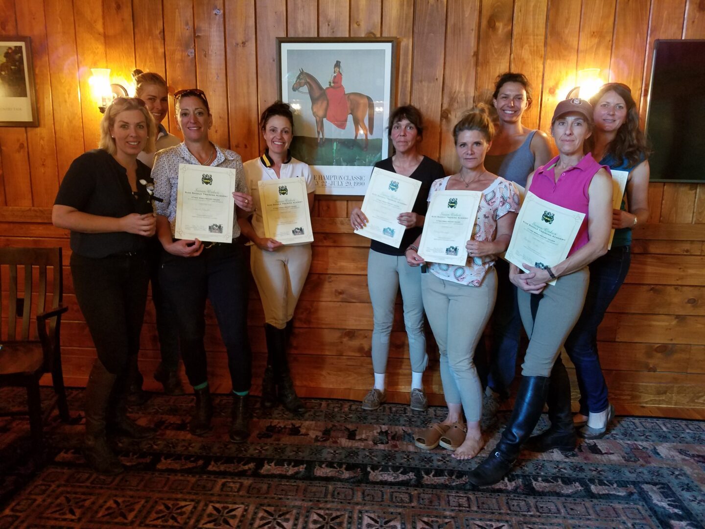 Group image of some people holding a certificate